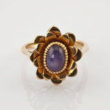 Verspielter Blütenring aus Gold mit Amethyst