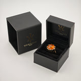 Schwarze Schmuckbox mit goldenem Ring und orangem Edelstein, Deckel mit YourVintage-Logo.