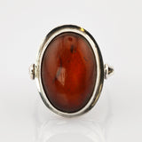 Silberring mit großem ovalem poliertem Bernstein, tiefrotbraun mit natürlichen Einschlüssen
