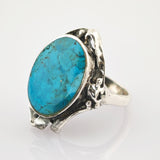 Silberring mit ovalem Türkisstein in rustikalem, texturiertem Fassungsdesign
