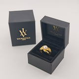Eleganter Goldring mit Perle und Glaselementen
