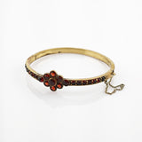 Vergoldeter Armreif mit Granatbesatz