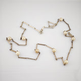 Lange Silberkette mit Perlen