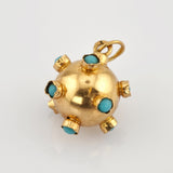 Exotischer Kugelanhänger aus Gold mit türkisen Cabochons