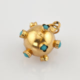 Exotischer Kugelanhänger aus Gold mit türkisen Cabochons