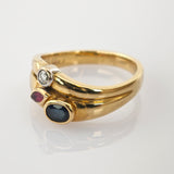 Goldring mit ovalem blauem Saphir, marquiseförmigem rotem Rubin und weißem Diamanten in Platinfassung