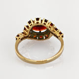 Stilvoller geschwungener Ring aus Gold mit 15 Granaten