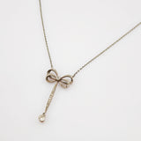 Kette Gold Platin Schleifenmotiv mit Diamanten im Stil Art-déco