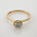 Schlanker Goldring mit rundem Diamant in zarter Weißmetallfassung und Goldperlendetails im Vintage-Stil