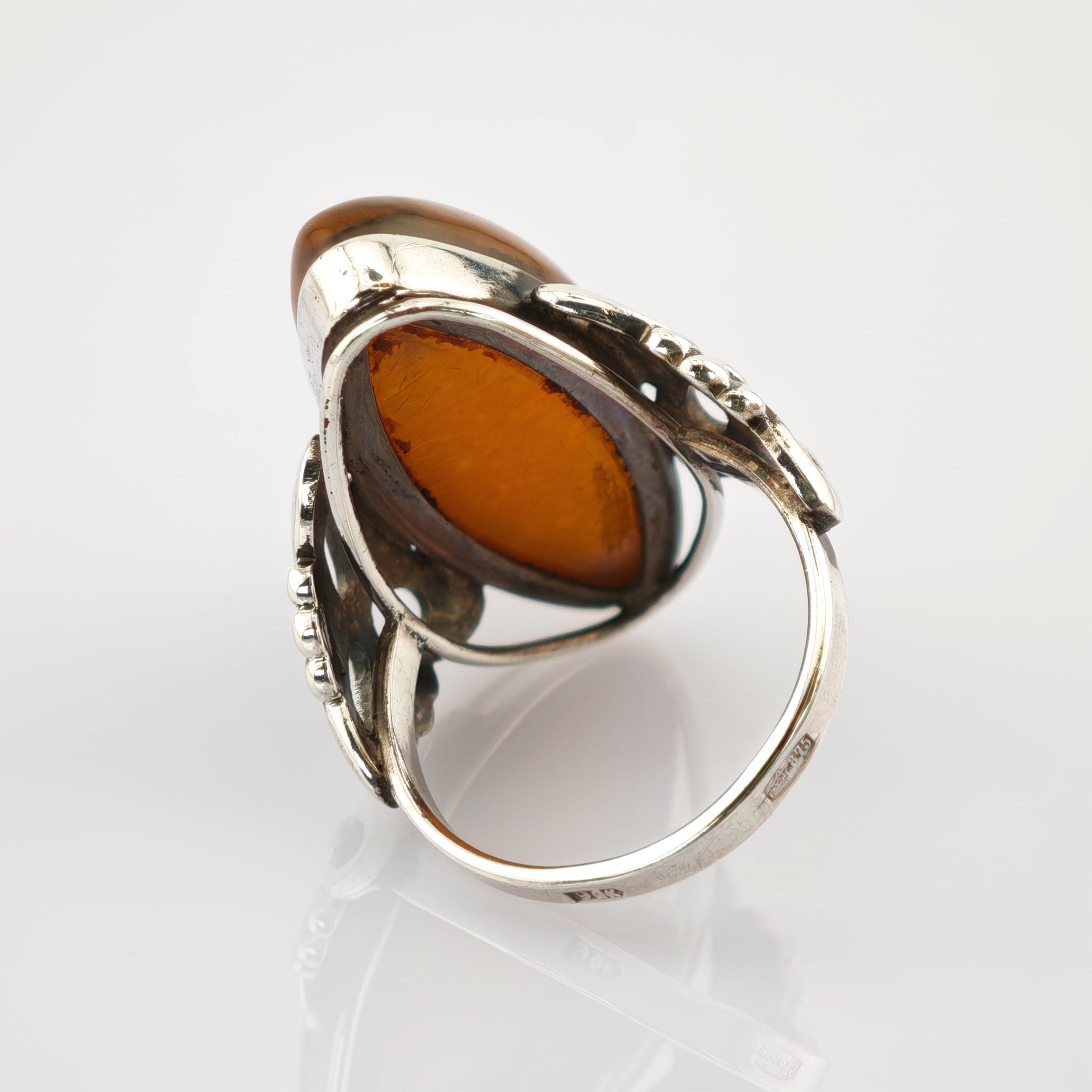 Silberring mit ovalem bernsteinfarbenem Stein und filigranem Design, Gravur "925 Bernd Wolf Germany".