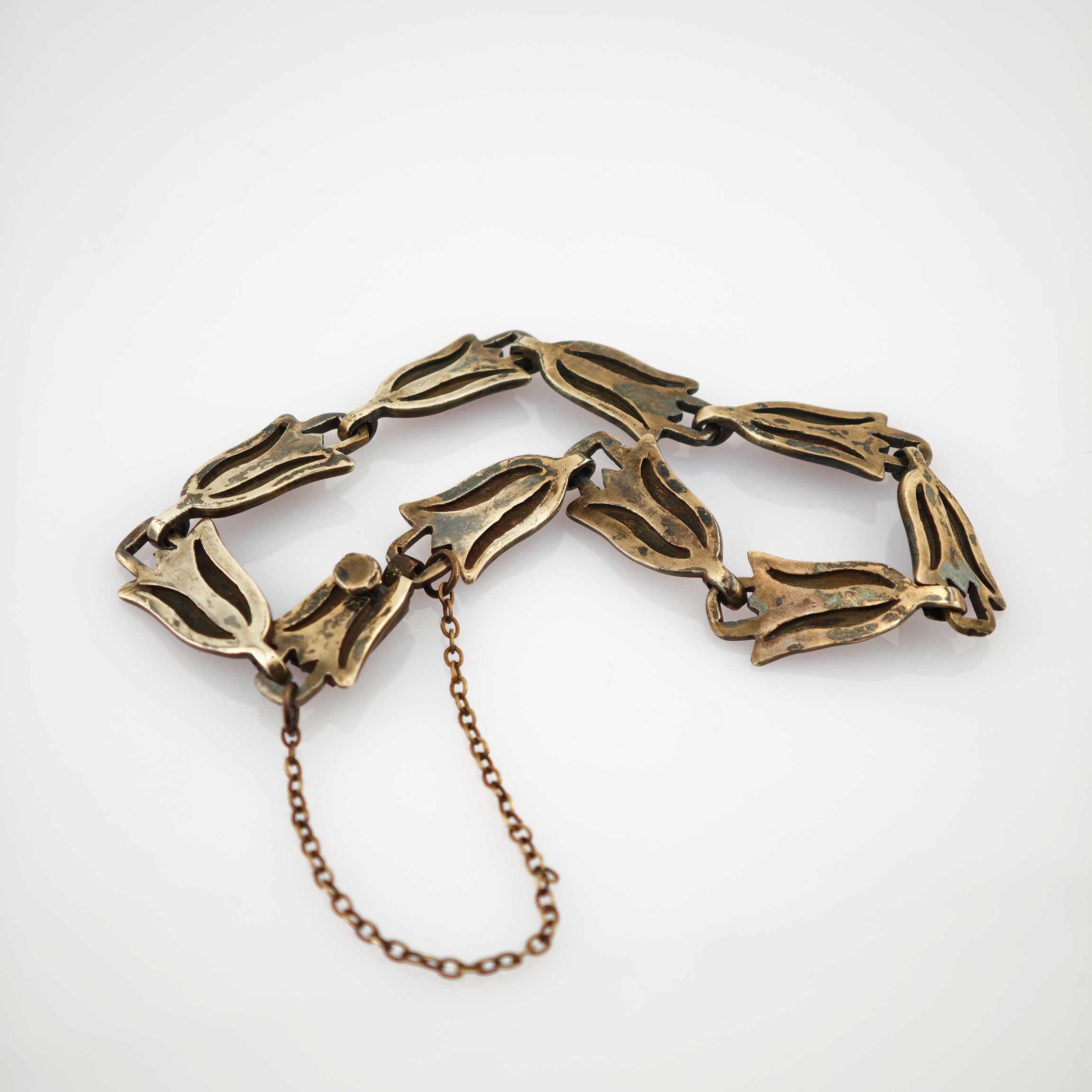 Vintage-Armband aus goldfarbenen tulpenförmigen Metallgliedern mit Kettenschloss