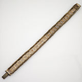 Edles Vintage-Armband mit griechischem Schlüsselmuster und feiner Perlenkante in metallischen Tönen.